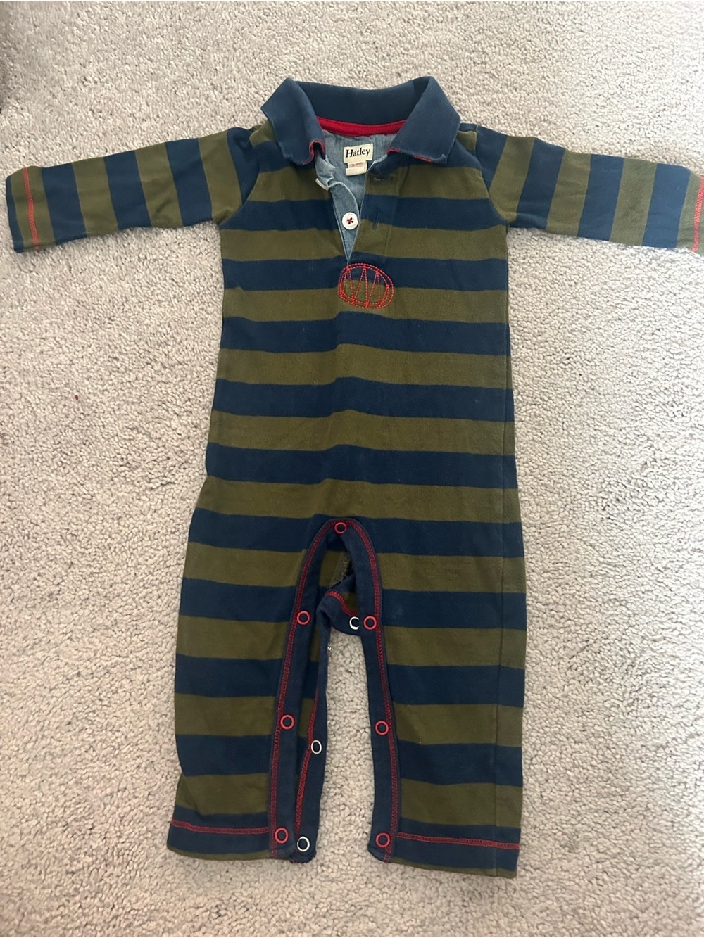 Hatley striped polo romper featuring a collared neckline and red accent